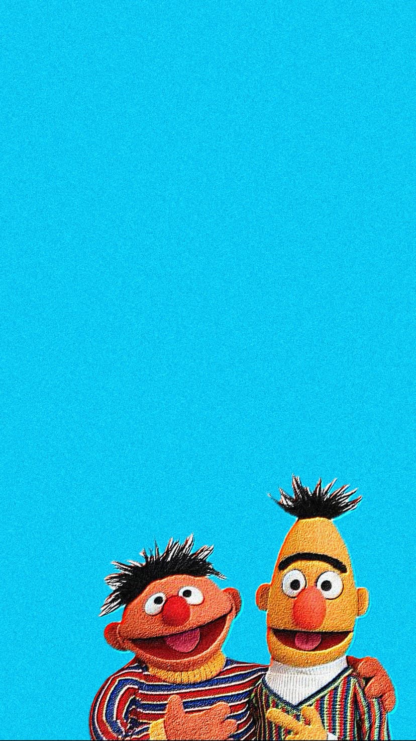 Bert and Ernie stand side-by-side in striped sweaters against a solid blue background for mobile devices.