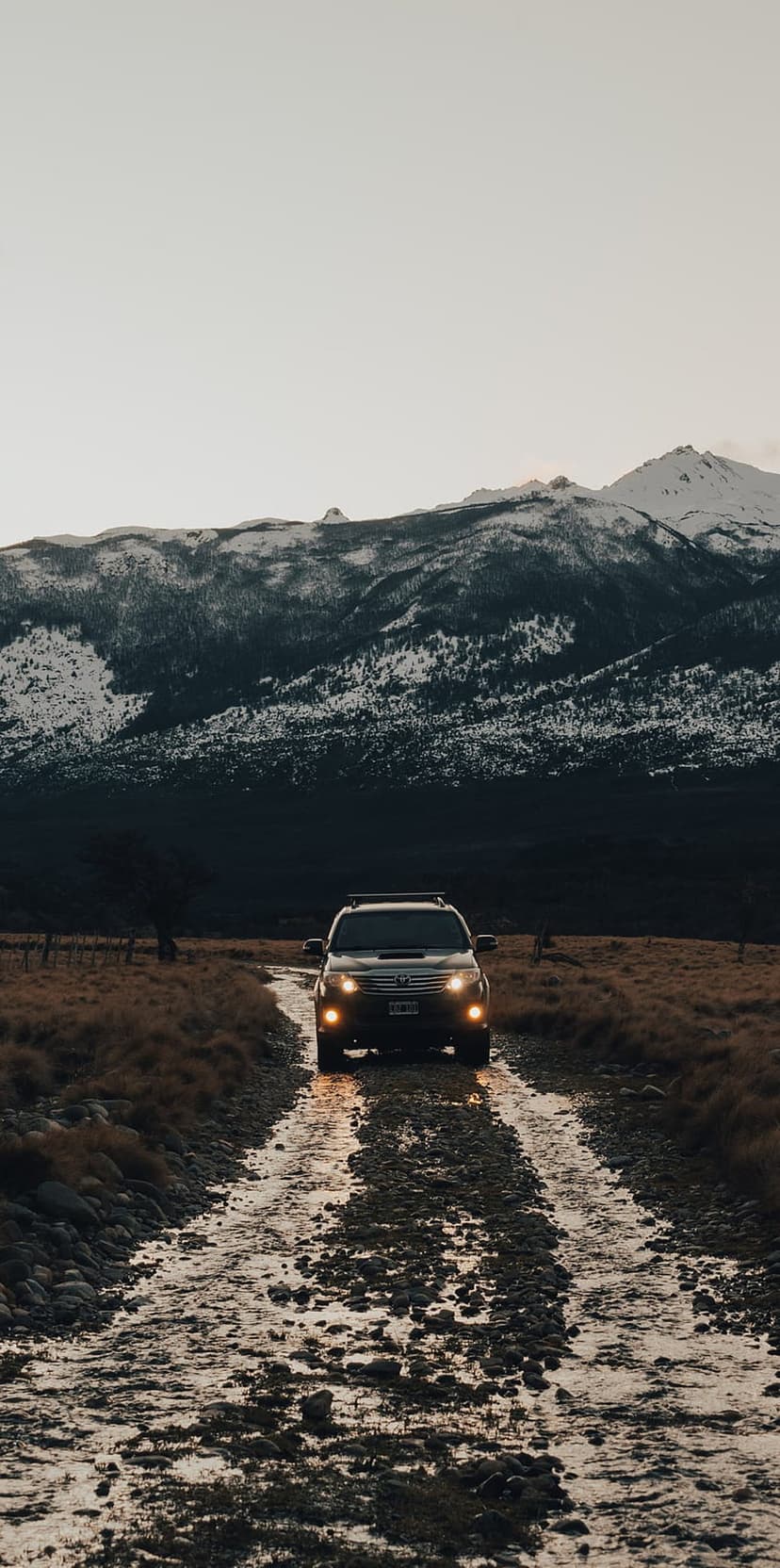 Rugged Off-Road SUV Mountain Trek Dusk Phone Background
