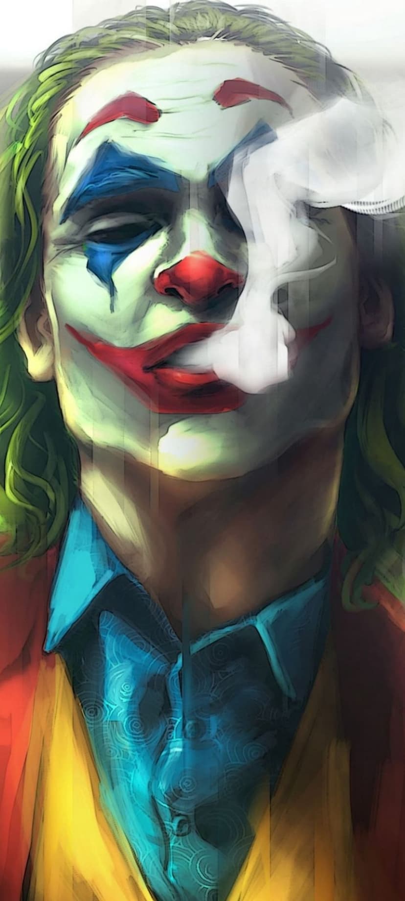 Arthur Fleck in clown makeup exhales a cloud of smoke while wearing a colorful suit against a dark background.