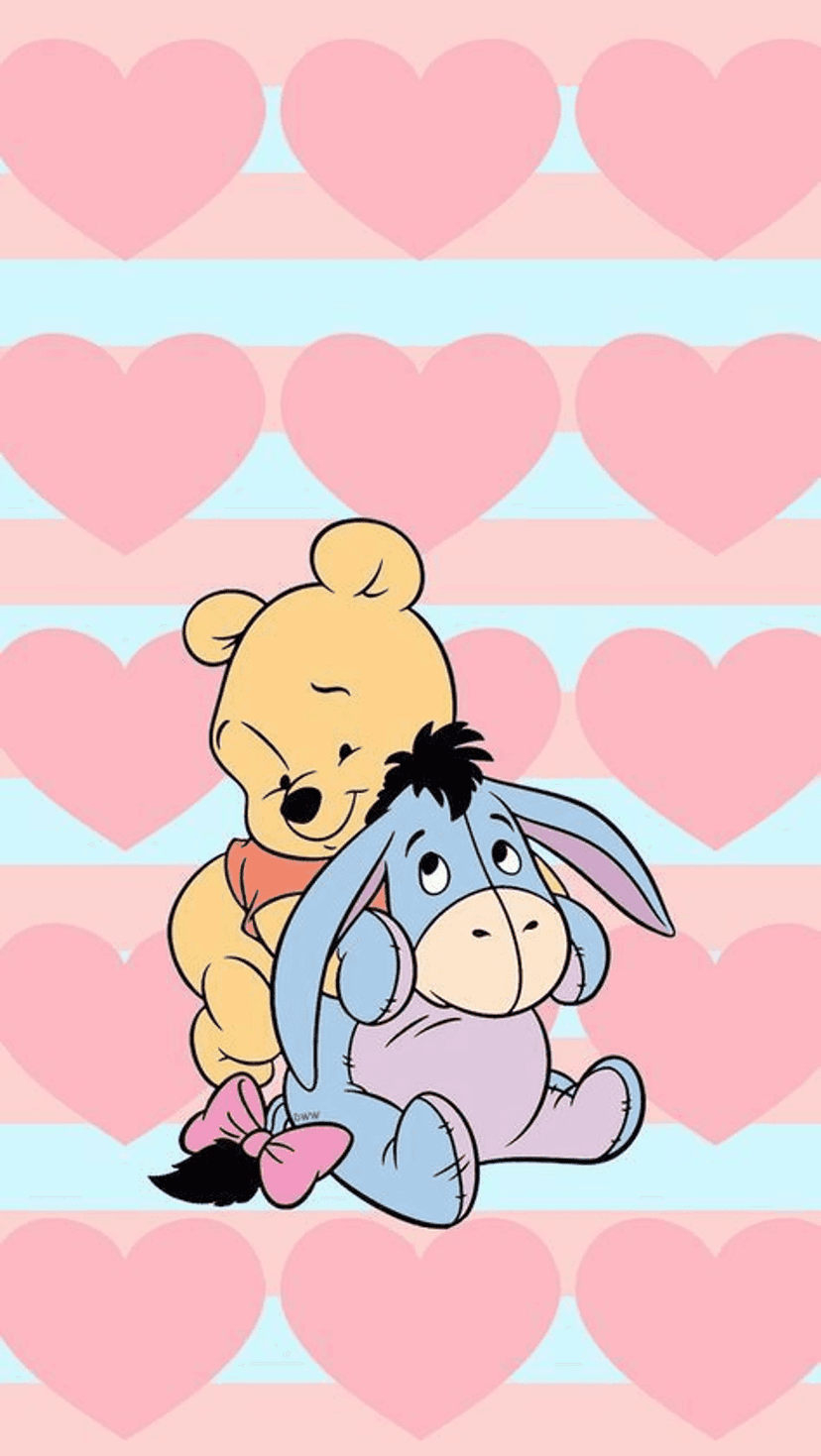 Winnie the Pooh hugs Eeyore who has a pink bow on his tail over a pink heart and blue striped background.