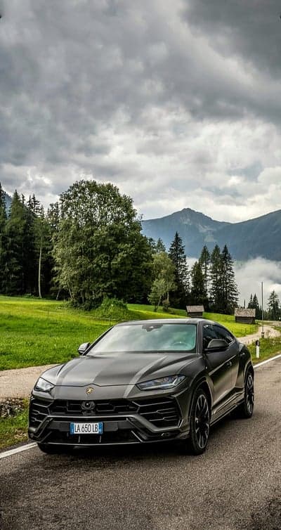 Dark Grey Lamborghini Urus Alpine Road Phone Backdrop