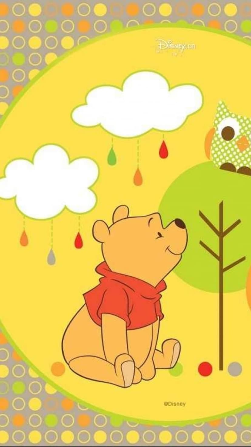 Winnie the Pooh smiles at colorful raindrops while an owl sits on a branch against a yellow polka dot sky.