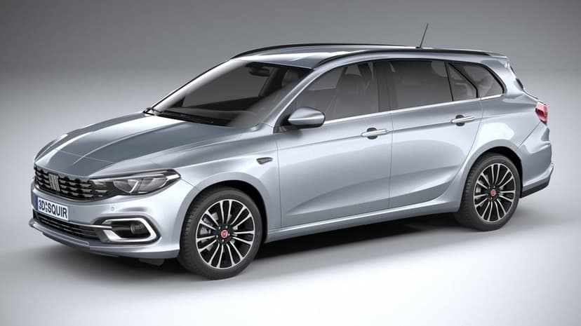 Silver Fiat Tipo station wagon with alloy wheels and roof rails parked in a brightly lit grey studio space.