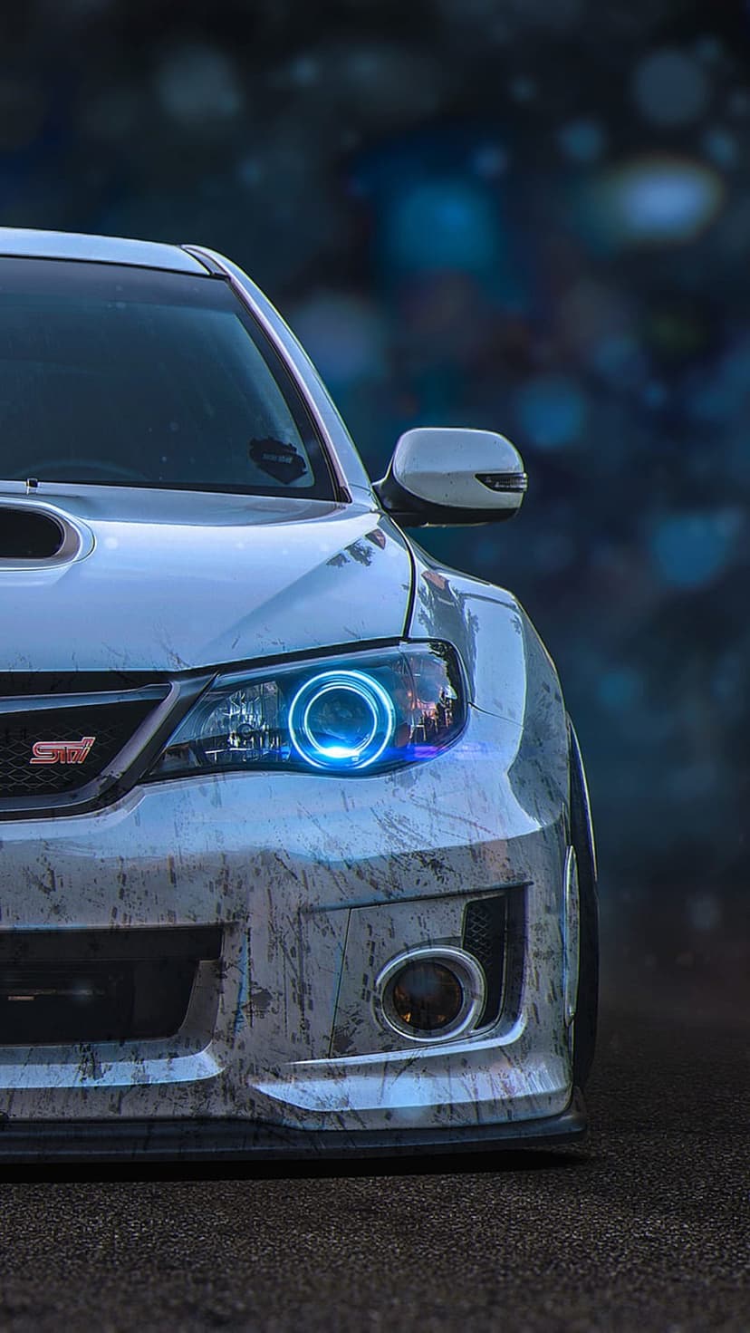 Subaru Impreza WRX STI with blue halo headlights and textured paint against a blurred urban bokeh background.