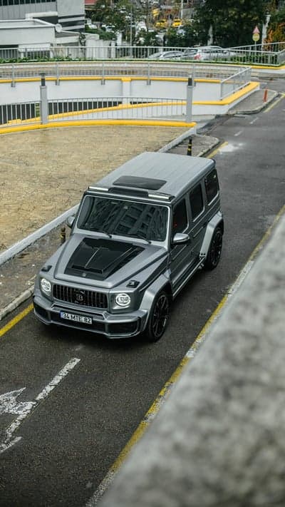 Brabus G-Wagen Driving on Wet Asphalt Road