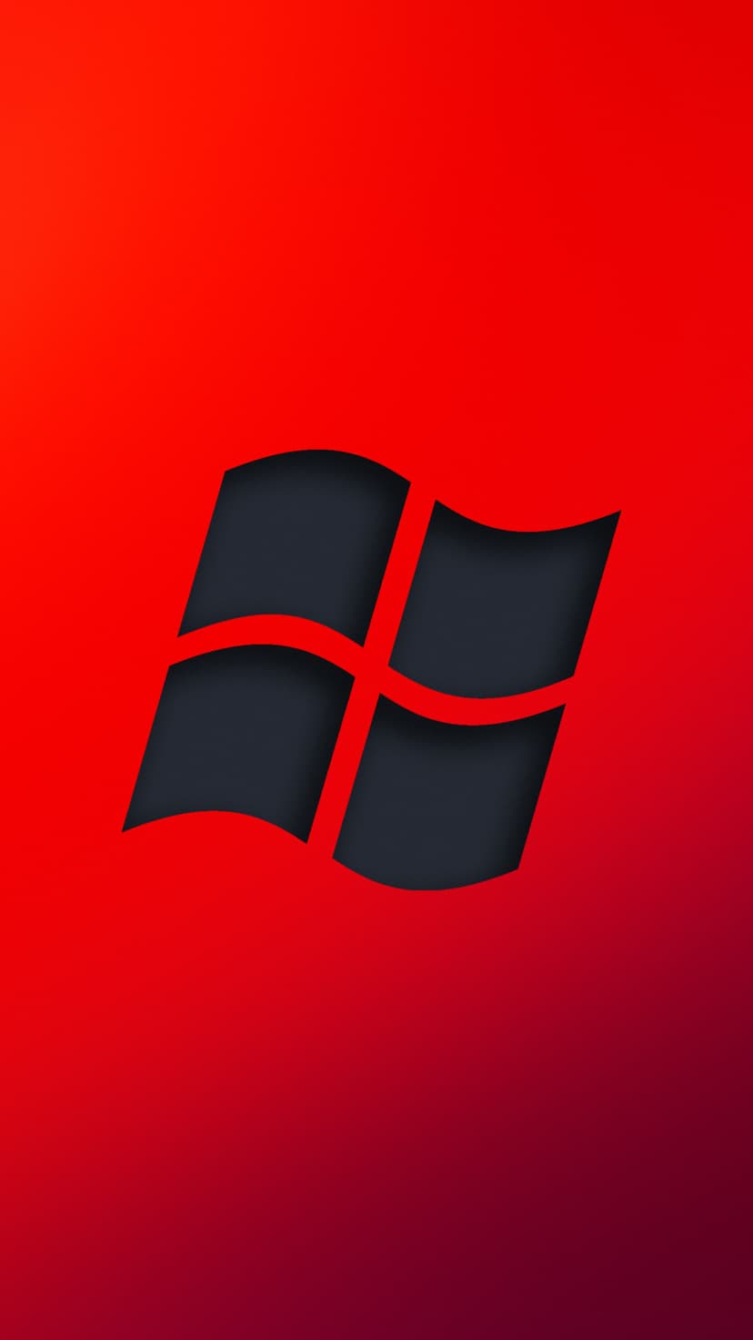 Windows logo in dark gray with a red glow centered on a vibrant red to deep purple gradient background.