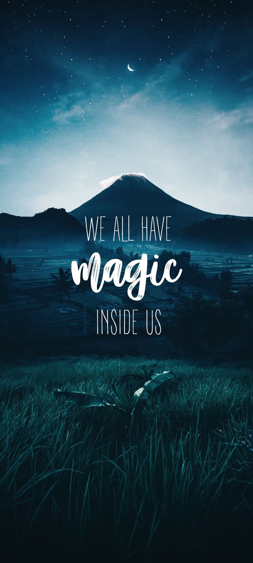Majestic mountain under a crescent moon and starry sky with the quote We All Have Magic Inside Us on green grass.