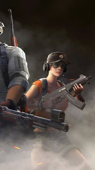 Two soldiers in tactical gear with guns in smoky background