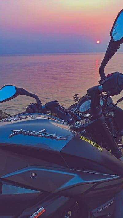 Pulsar Bike at Twilight Beach Sunset Phone Wallpaper