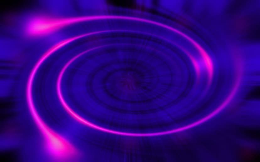 Blue and pink glowing energy vortex spiraling toward a central point with radiant particles of light.