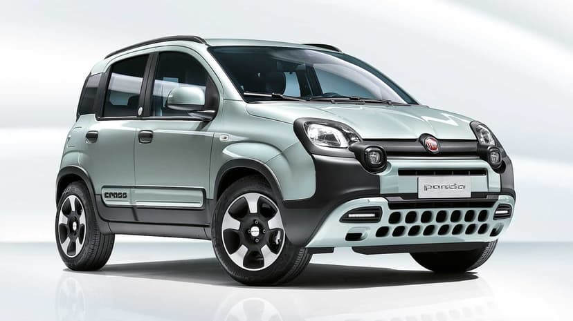 Front three-quarter view of a mint green Fiat Panda Cross car on a white studio floor with reflections.