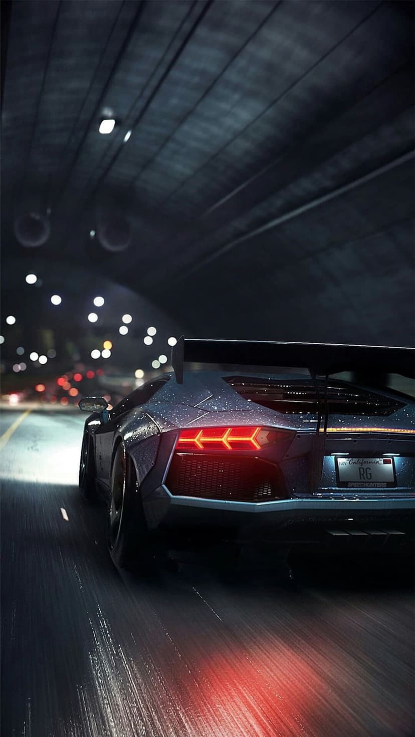 Lamborghini Aventador rear view in a dark tunnel with red taillights reflecting on wet asphalt at night.