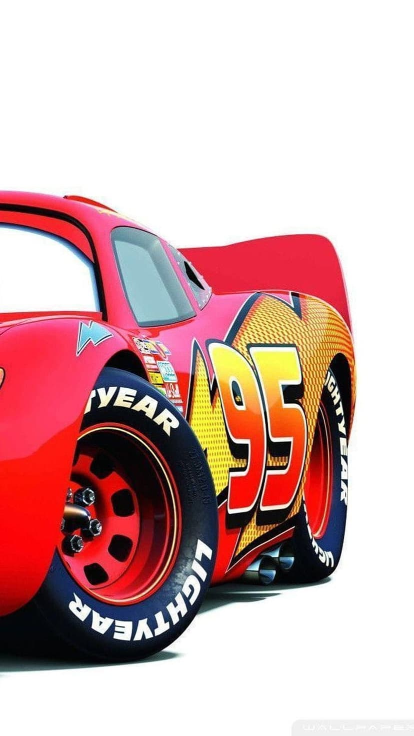 Lightning McQueen's red racing car features a yellow ninety-five decal and branded Goodyear tires on white.