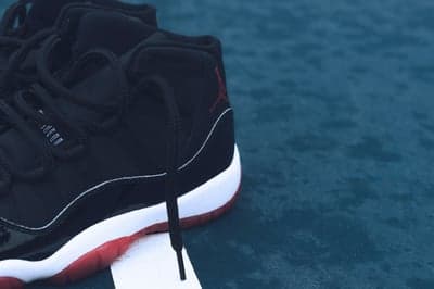 Black Air Jordan 11 "Bred" Sneakers with Red Sole
