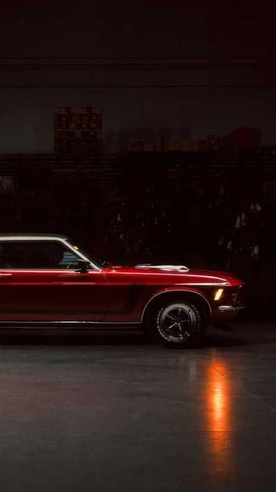Vintage Red Mustang in Dramatic Garage Lighting