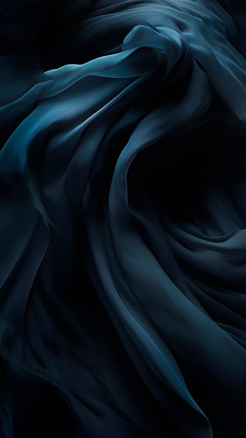 Dark teal fabric cascades in deep, shadowy folds with soft highlights accentuating a flowing silk texture.