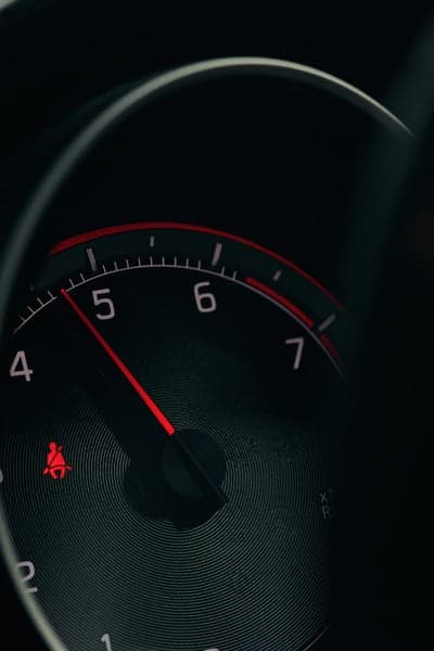 Car Tachometer Close-up with Seatbelt Light