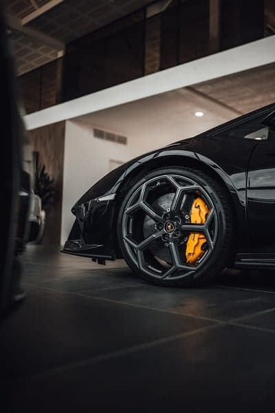 Sleek Black Lamborghini Wheel with Yellow Calipers