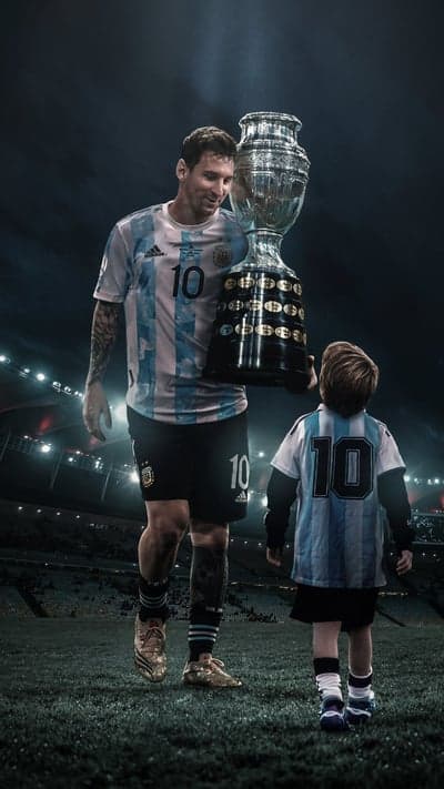 Messi and son with Copa America trophy on field