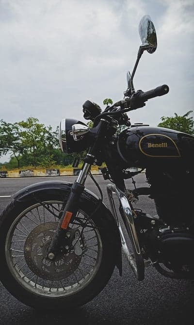 Classic Black Benelli Motorcycle on a Cloudy Day