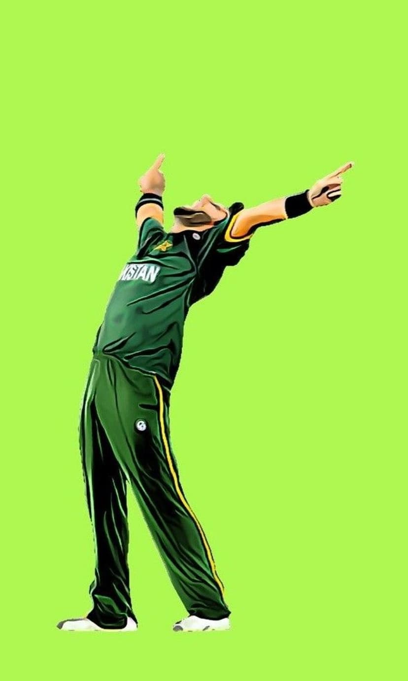 Cricket player in green and yellow kit celebrates with arms raised against a solid lime green background.