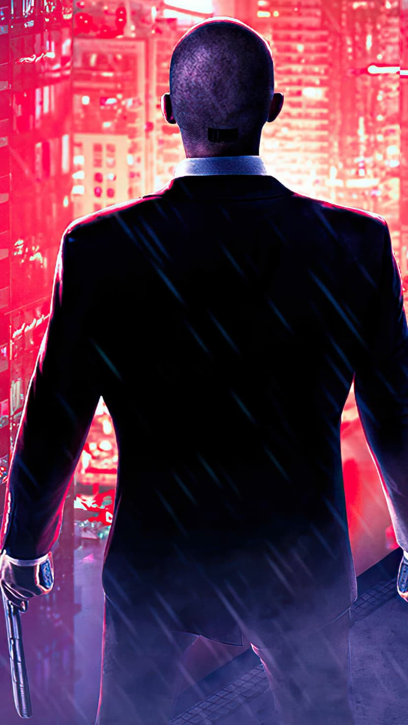 Agent 47 from behind in a black suit holding a pistol against a red neon city background with rain streaks.