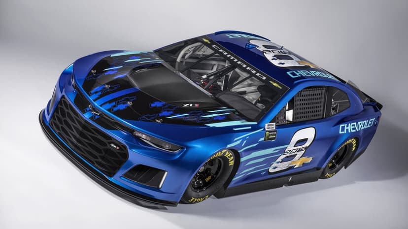 Blue Chevrolet Camaro ZL1 race car with cyan accents and white number 8 on a clean white studio background.