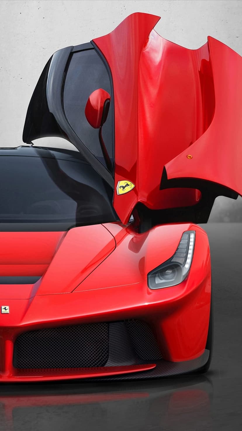 Red Ferrari supercar with open dihedral doors, showing LED headlights and a black interior in a portrait view.