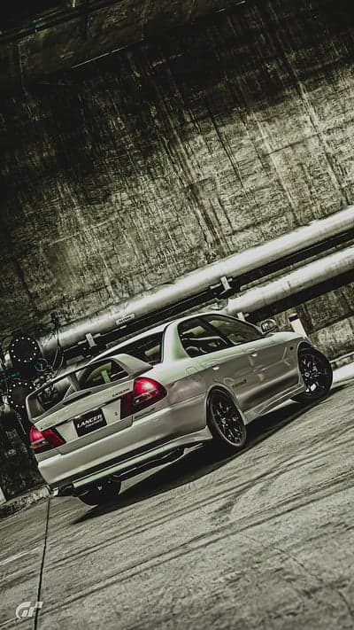 Silver Mitsubishi Evo VI Rear View Industrial Phone Background