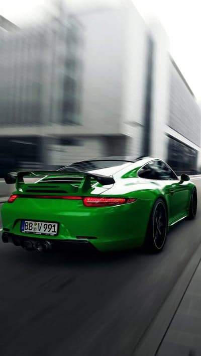 Dynamic Green Porsche 911 Urban Motion Mobile Wallpaper