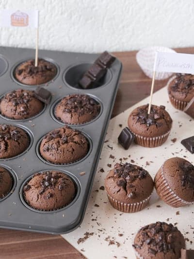 Chocolate chip muffins in a tin with decorations