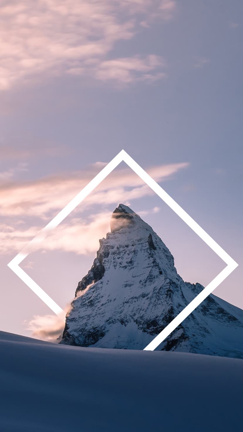 Matterhorn peak covered in snow rests within a white geometric frame against a soft pastel sky background.