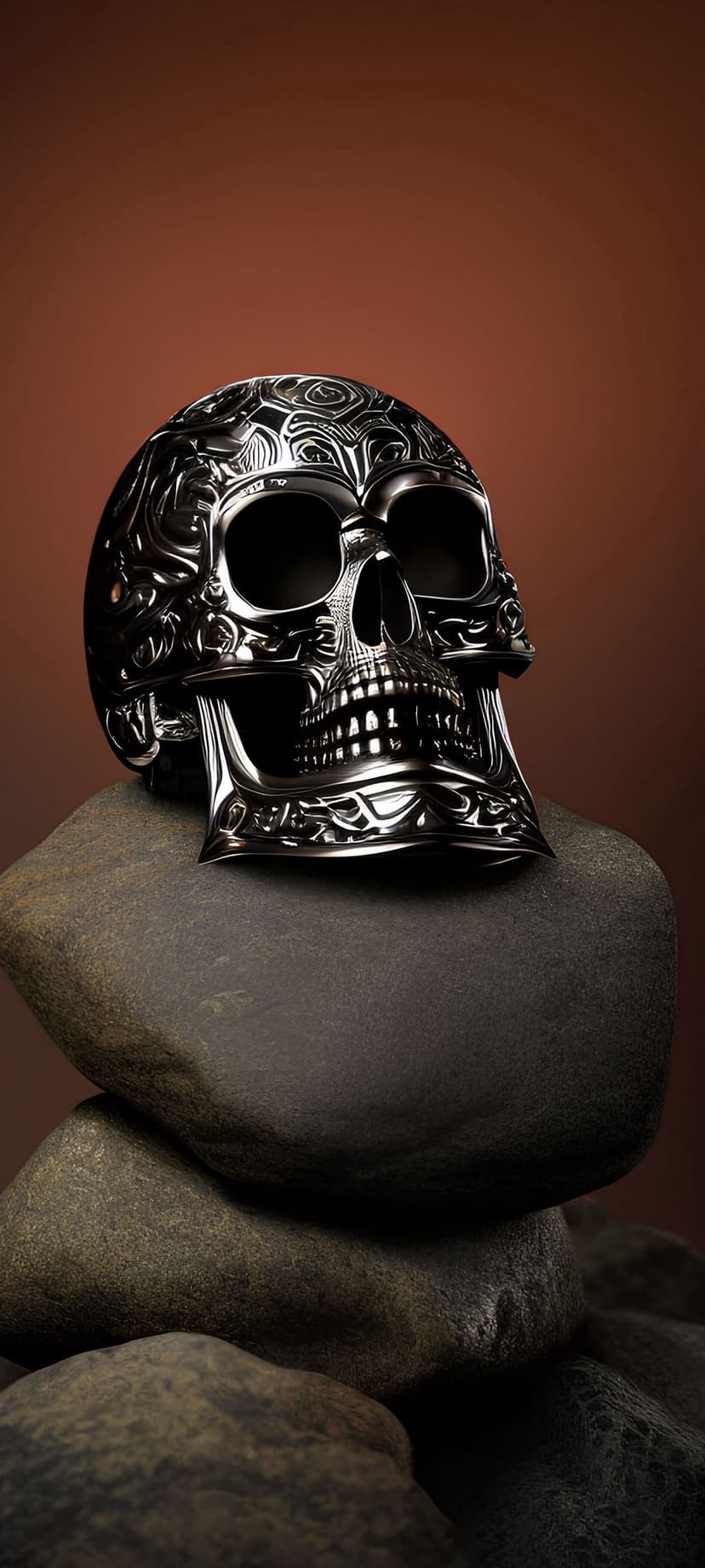 Ornate metal skull with swirling filigree patterns rests on a balanced stack of dark, textured weathered stones.