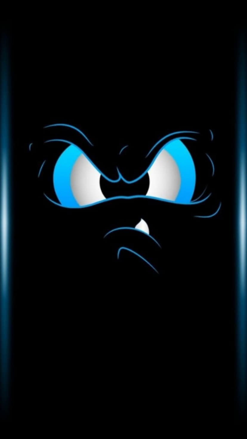 Glowing blue cartoon eyes with sharp eyebrows and a jagged tooth emerge from a pitch-black vertical background.