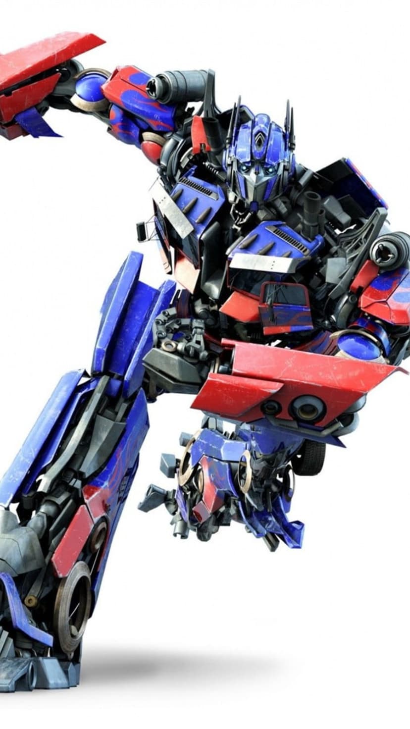 Optimus Prime stands in a heroic crouch with detailed red and blue robotic plating against a white background.