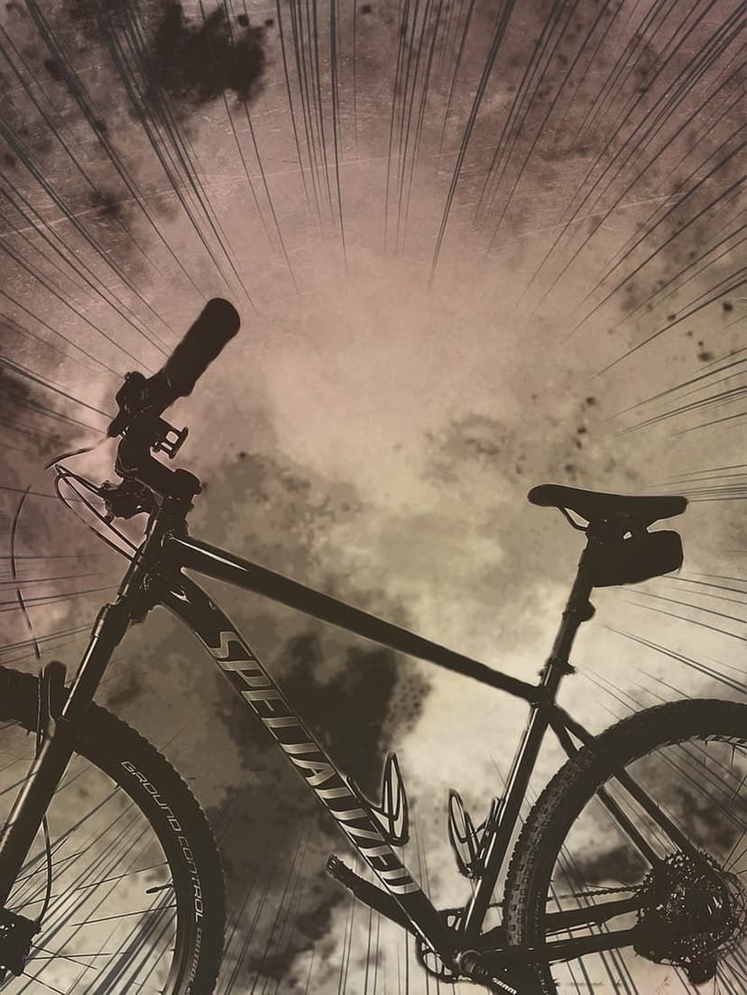 Specialized mountain bike silhouette stands against a dark cloudy sky with radial motion lines and grunge textures.