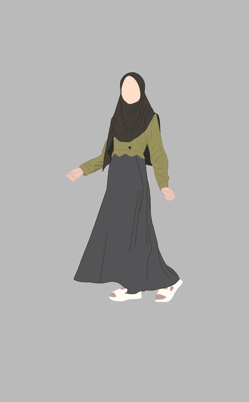 Woman wearing a dark hijab, green top, and grey flowy skirt stands against a solid neutral grey background.