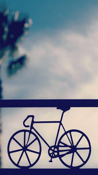 Minimalist Cycling Silhouette Pastel Sky Mobile Backdrop