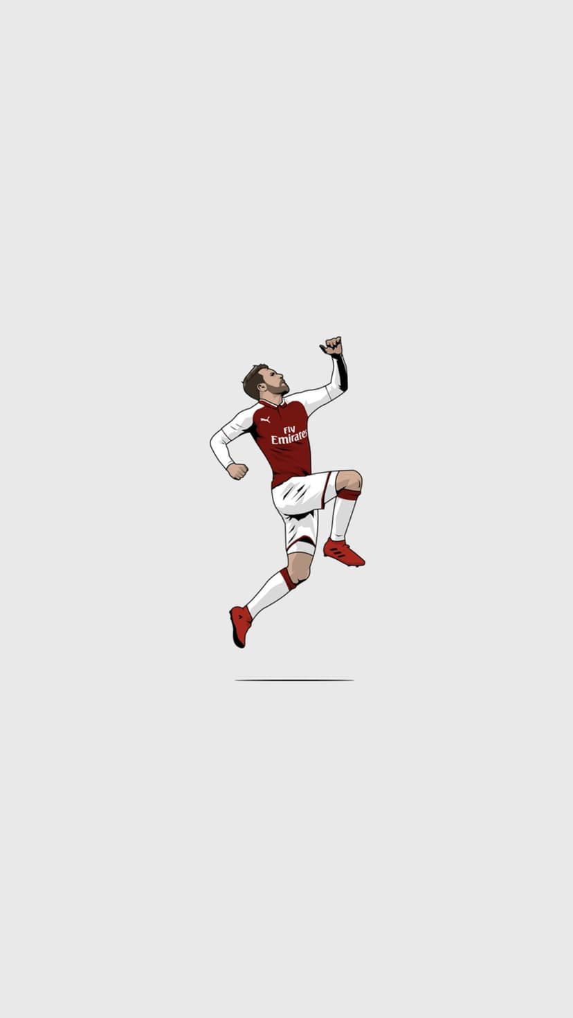 Soccer player in a red and white jersey leaps with a clenched fist against a plain light gray background.