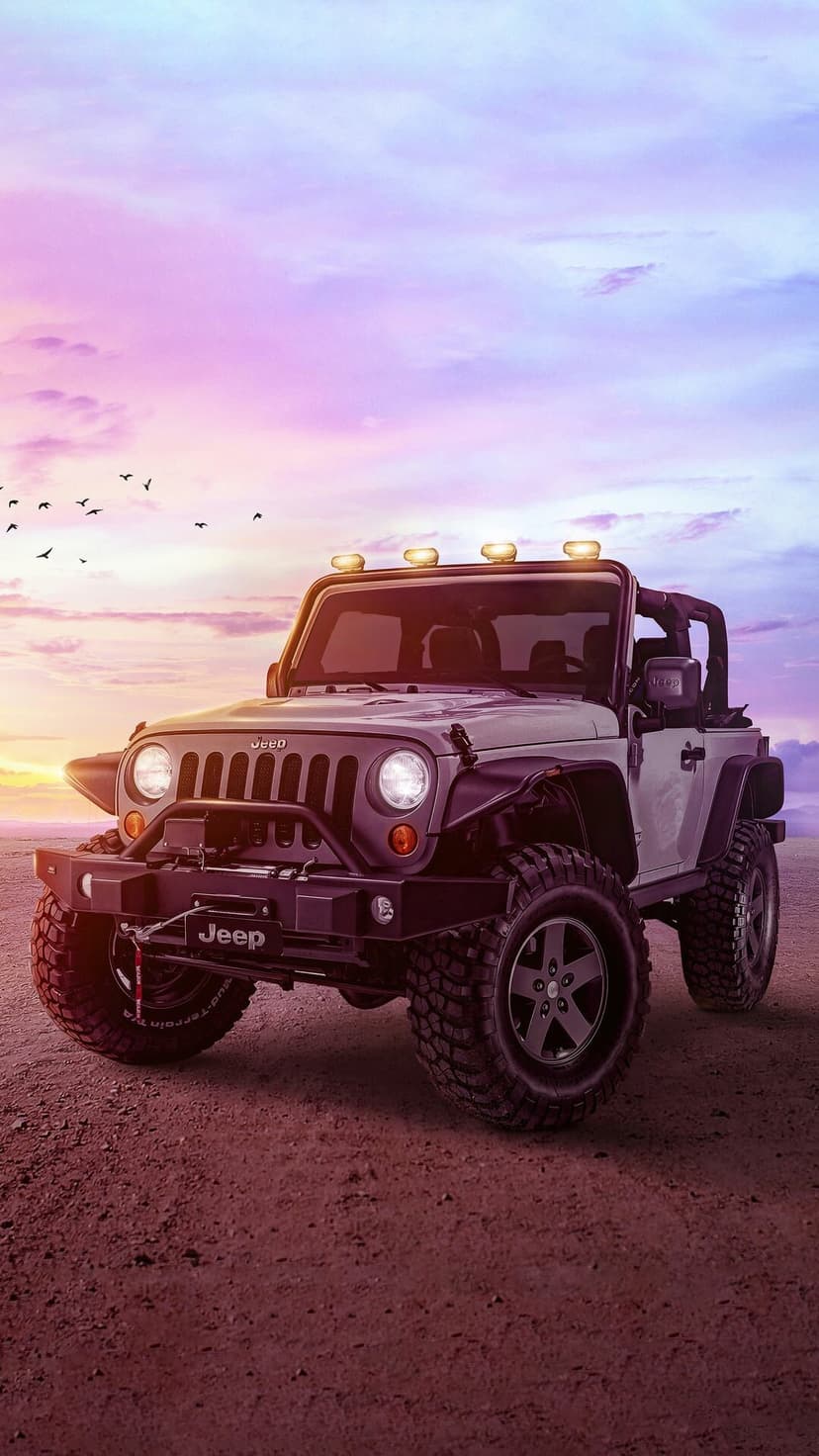 White Jeep Wrangler off-road vehicle on desert terrain under a purple and pink sunset sky with birds.