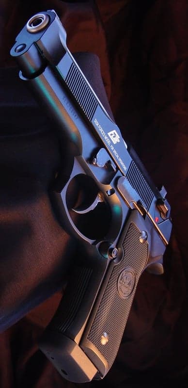 Close-up of a tactical handgun with intricate details