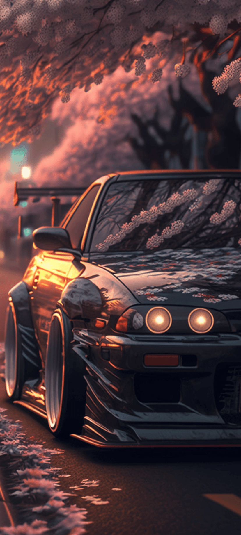 Dark widebody sports car with glowing headlights parked on a street under pink cherry blossoms at sunset.