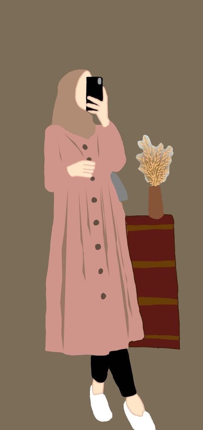 Woman in a pink dress and hijab takes a selfie near a vase of dried flowers against a dark brown background.