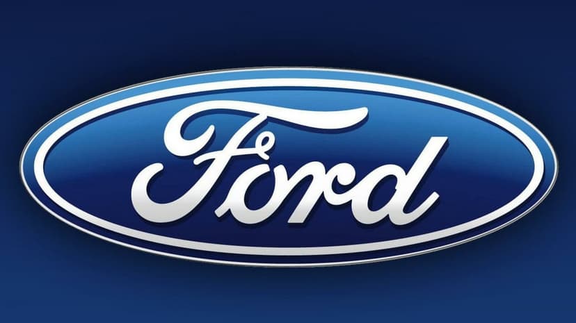Ford logo with white script text inside a chrome-bordered blue oval against a dark blue gradient backdrop.