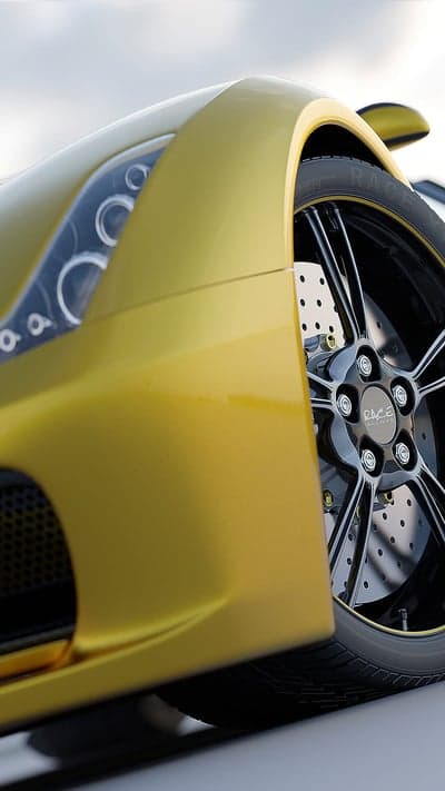 Yellow Sports Car Wheel and Headlight Detail