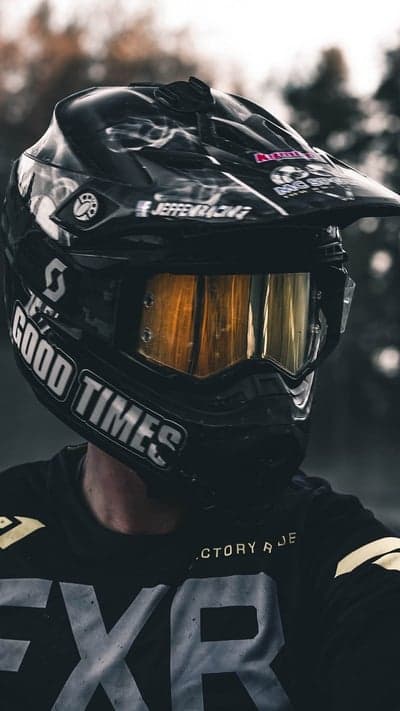 Motocross Rider in Full Gear with Golden Goggles