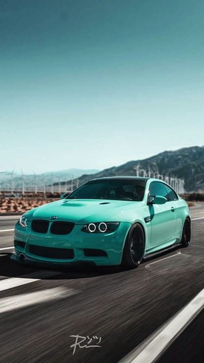 Teal BMW M3 Coupe on Desert Highway