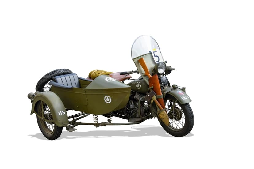 Vintage military motorcycle with sidecar featuring olive drab paint, a white star, and a wooden propeller.