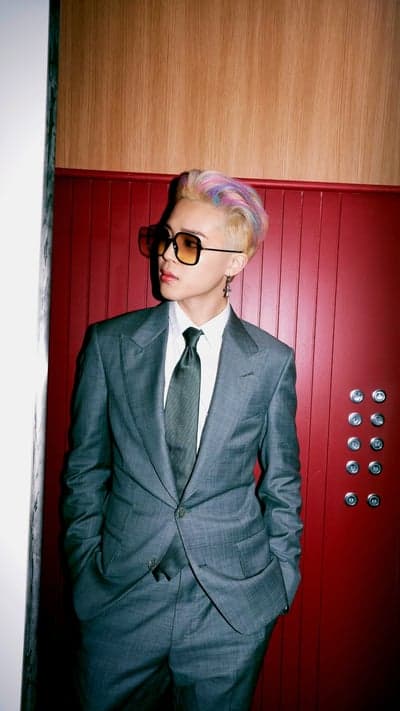 Man in Gray Suit with Colorful Hair and Sunglasses