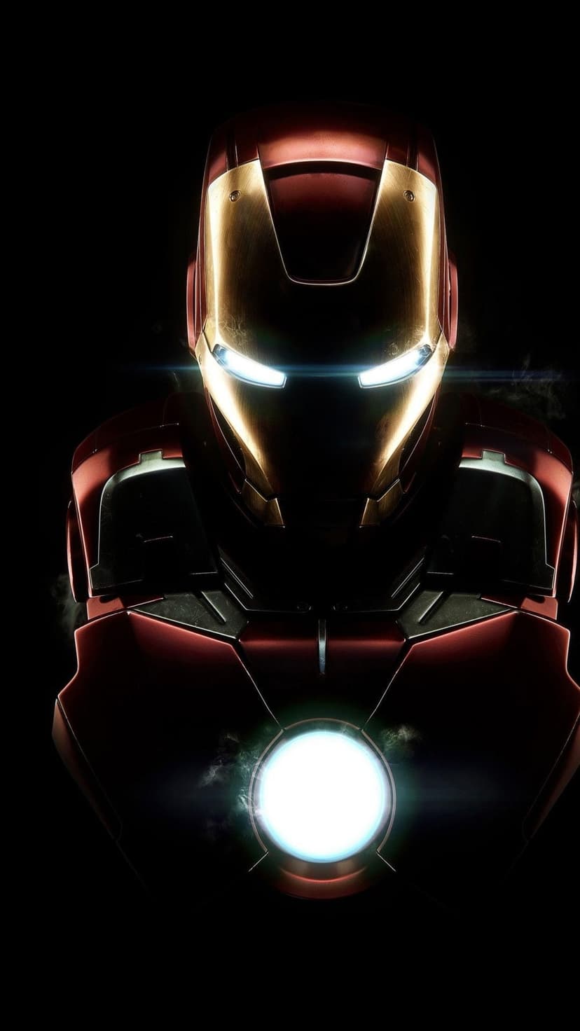 Iron Man helmet with white glowing eyes and a blue arc reactor on a red and gold suit against a black backdrop.